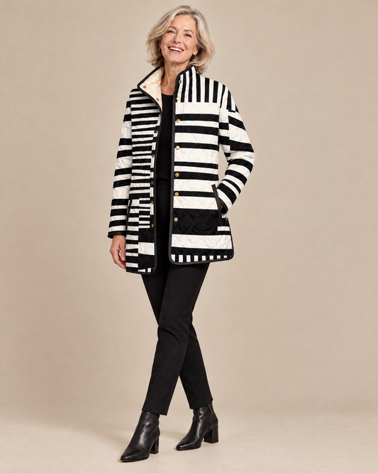 Woman posing in the Miren black and white abstract quilted jacket