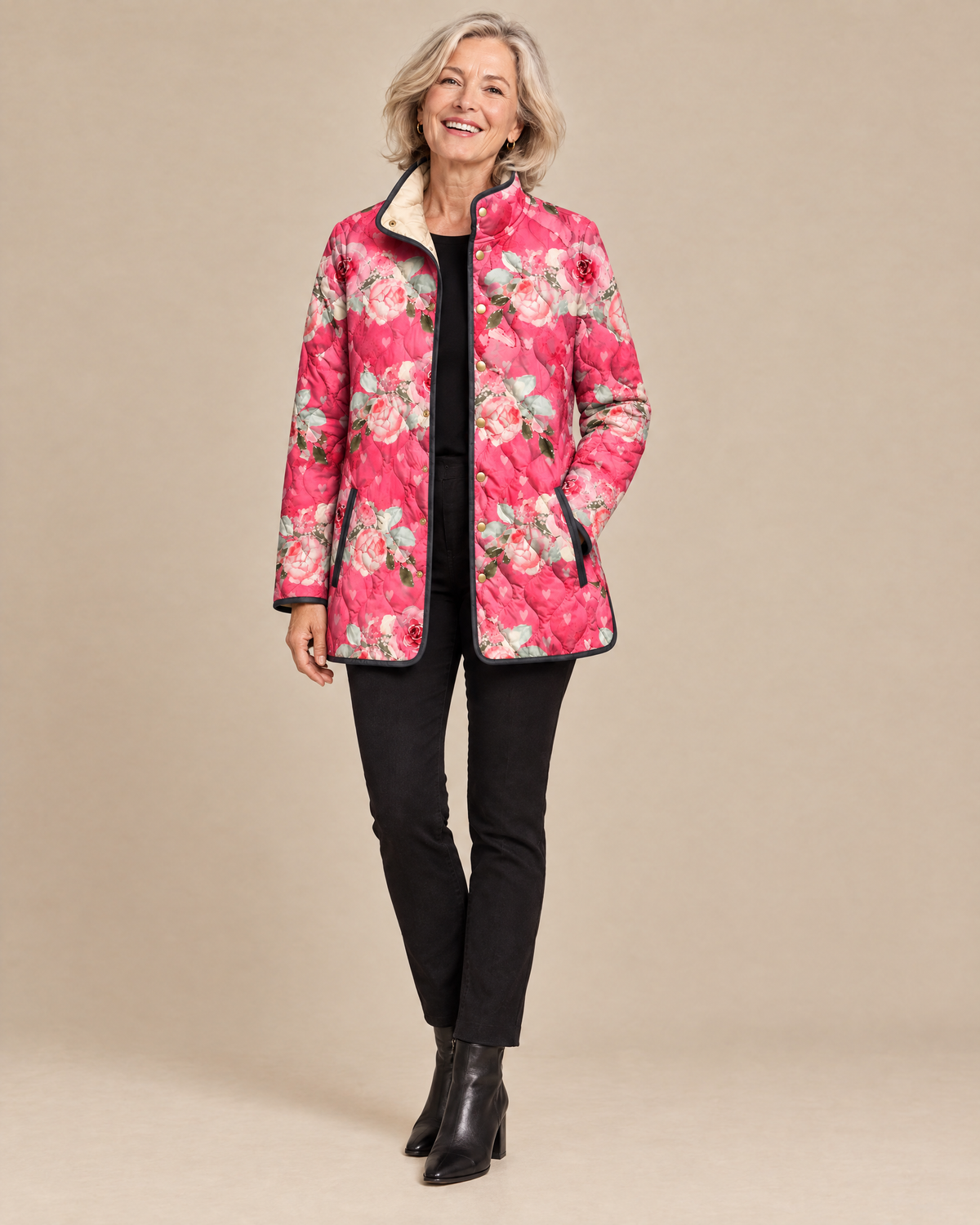 Woman wearing the Freya pink floral print quilted jacket, front view