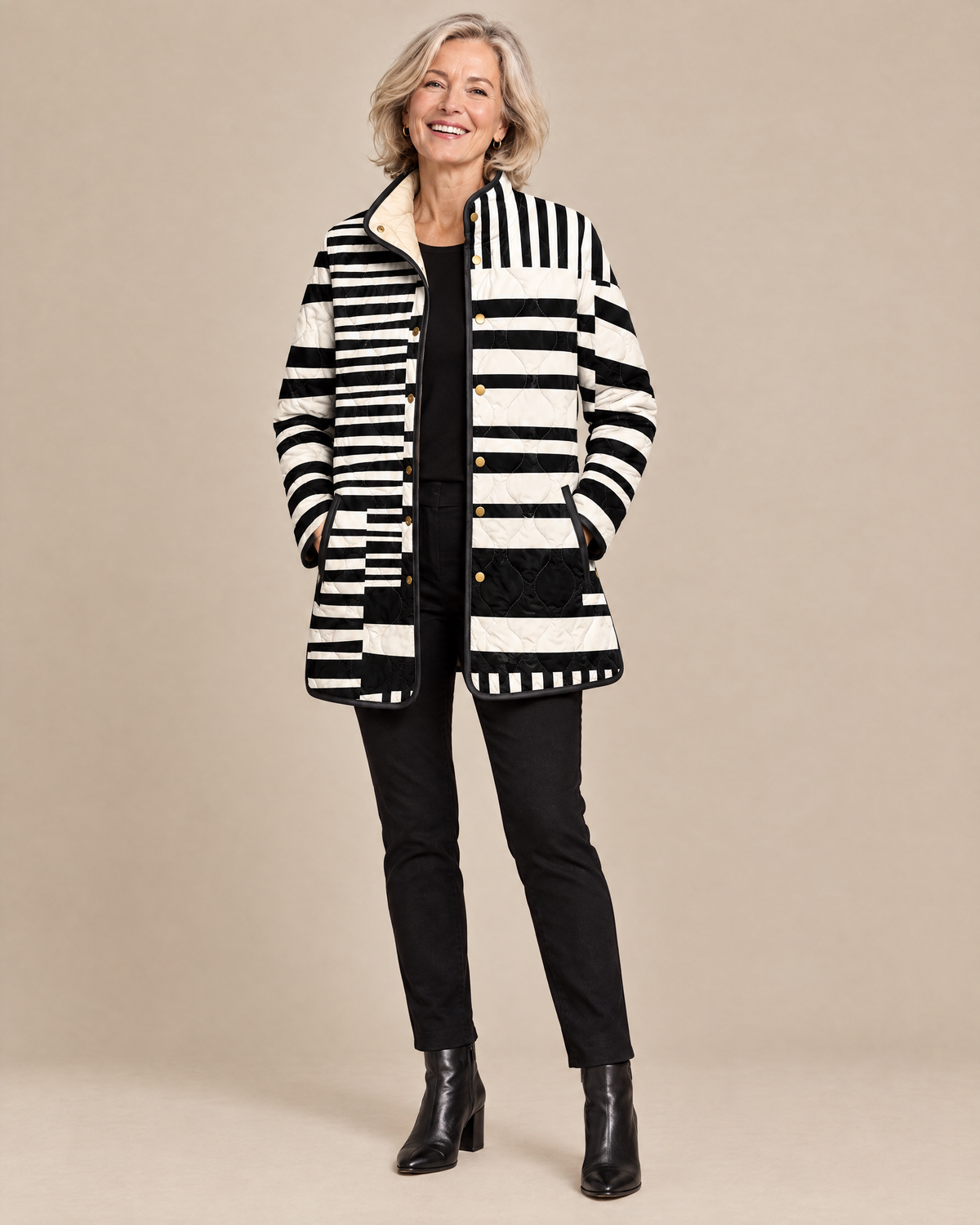 Woman wearing the Miren black and white abstract quilted jacket, front view