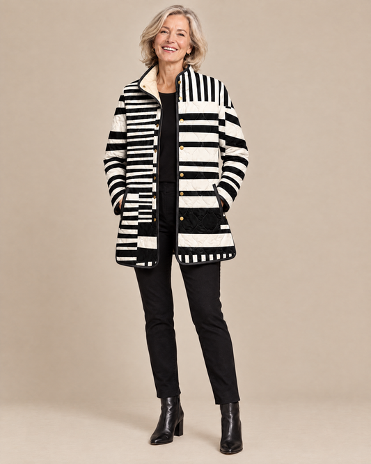Woman wearing the Miren black and white abstract quilted jacket, front view