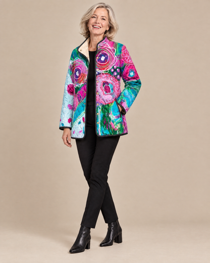 Woman posing in the Isabella elegant floral pattern quilted jacket