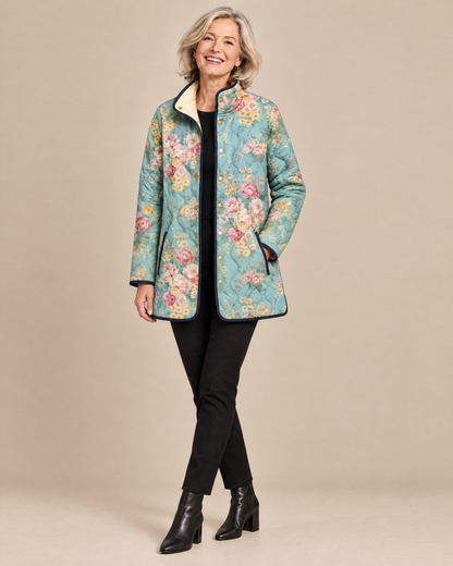 Woman wearing the Elara quilted floral print jacket, front view