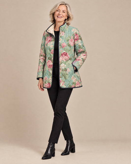 Woman posing in the Carys retro floral patterned quilted jacket