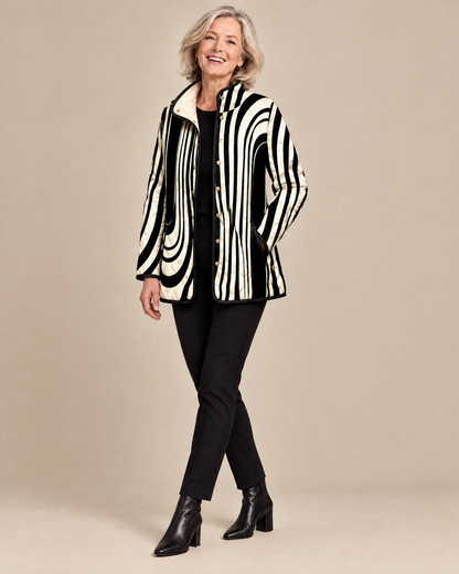 Woman posing in the Soraya abstract geometric quilted jacket