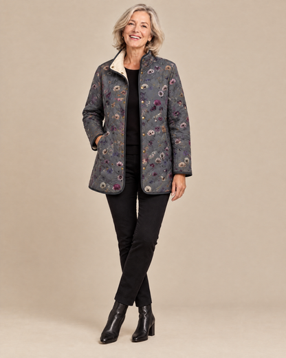 Woman wearing the Niva vintage floral print quilted jacket, front view