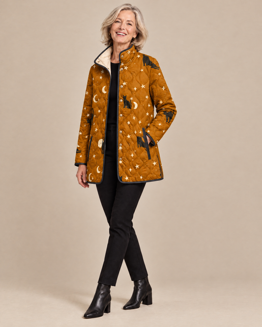 Woman posing in the Maya black quilted jacket with cat pattern