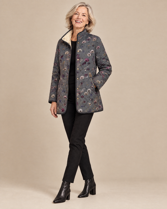 Woman posing in the Niva vintage floral print quilted jacket